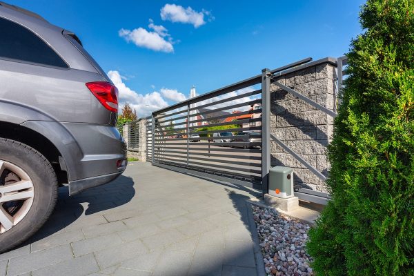 Driveway of a modern single-family house with an automatic gate